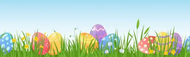 Vector illustration of Cartoon easter eggs on meadow green grass seamless border. Spring lawn with painted egg and flowers. Happy easter day hunt vector background