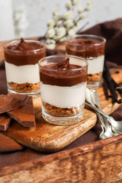 istock Chocolate Cheesecake Cream Dessert with Cookie Crumble in rustic kitchen 1366250551