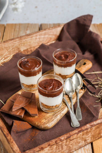 istock Chocolate Cheesecake Cream Dessert with Cookie Crumble in rustic kitchen 1366250557