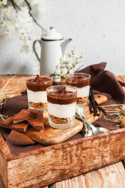 istock Chocolate Cheesecake Cream Dessert with Cookie Crumble in rustic kitchen 1366250561