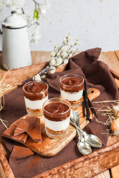 istock Chocolate Cheesecake Cream Dessert with Cookie Crumble in rustic kitchen 1366250567