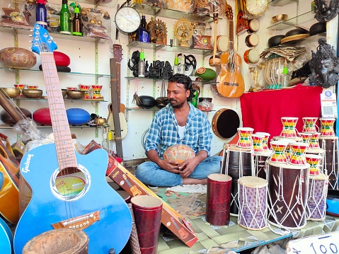 Karnataka, INDIA - 23 December 2021, Unidentified street shop vendor selling musical instruments in Gokarna Mahabaleshwar, Karnataka.