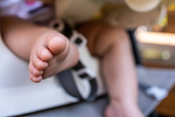 istock Baby girl foot. 1366258347