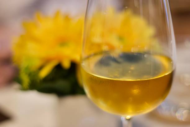 istock White wine glass on dinner table in Italian restaurant, under enjoyable feast concept work 1366259607