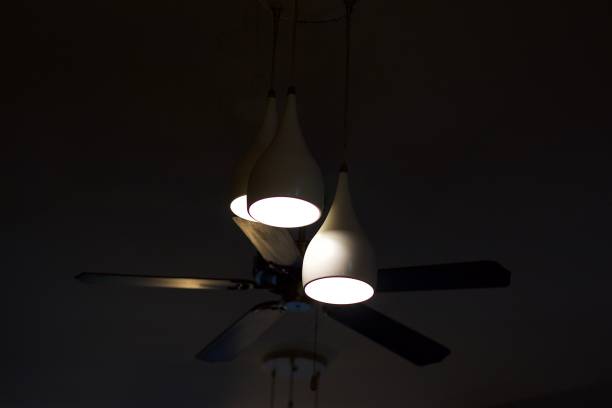istock Decorative ceiling lights with ceiling fan in a restaurant, for interior design concept 1366259872