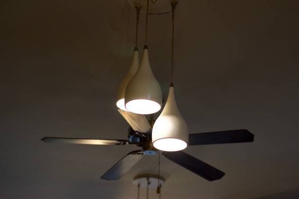 istock Decorative ceiling lights with ceiling fan in a restaurant, for interior design concept 1366259922