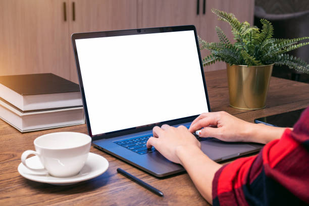 istock Woman working on laptop with white screen. Work from home. 1366262002