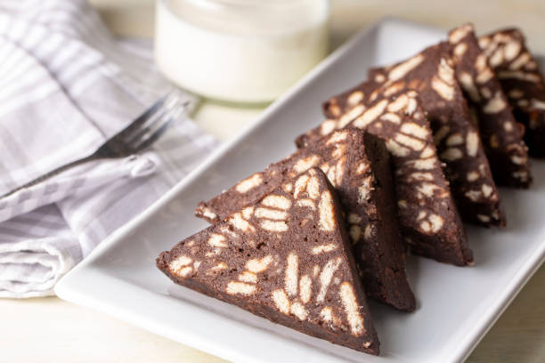 istock Delicious mosaic chocolate and biscuit cake served in a white plate (Turkish name; Mozaik pasta or Mozaik kek) 1366263130