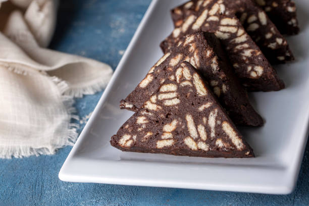 istock Delicious mosaic chocolate and biscuit cake served in a white plate (Turkish name; Mozaik pasta or Mozaik kek) 1366264391