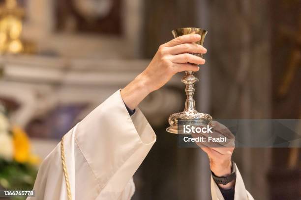 The Goblet During The Eucharist Stock Photo - Download Image Now - Communion, Chalice, Catholicism