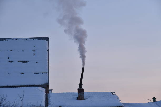 istock Pipe with smoke in the evening with sunset 1366266905