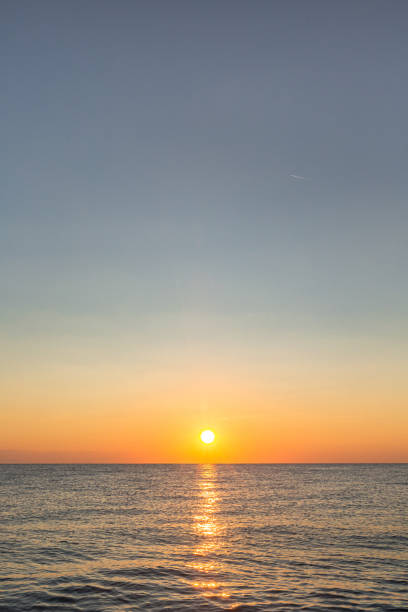 istock sunrise on the sea with reflection on the water 1366267002