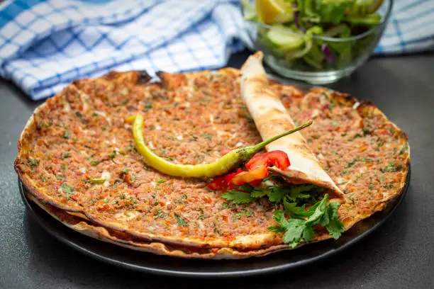 Türk yemekleri; Turk pizzasi - Lahmacun. Food concept photo.