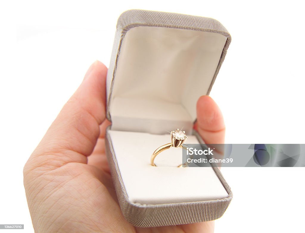 engagement ring A hand holds a diamond engagement ring in a jewel box. Box - Container Stock Photo