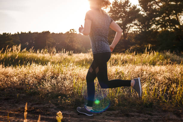 istock Woman running in nature during sunset 1366272785