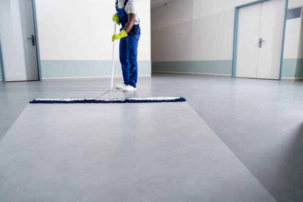 young man cleaning the floor with mop - caretaker imagens e fotografias de stock