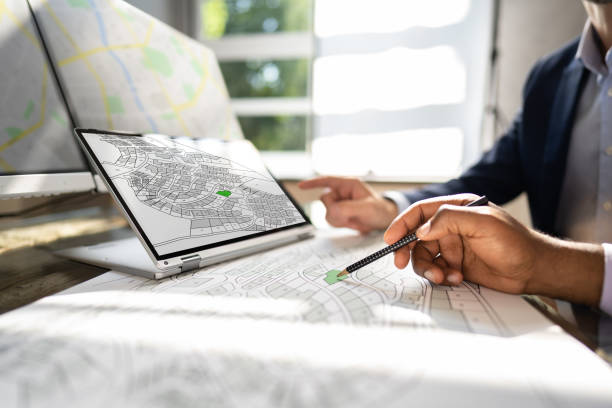 Cadastre Map And City Building Survey Cadastre Map And City Building Survey On Laptop land planning stock pictures, royalty-free photos & images