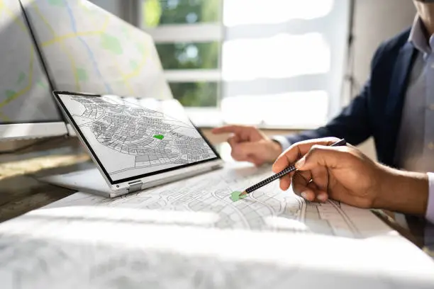 Cadastre Map And City Building Survey On Laptop