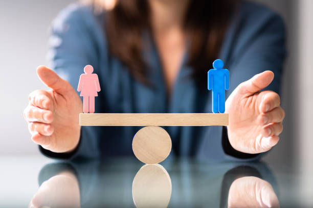istock Equal Gender Seesaw Balance 1366274114