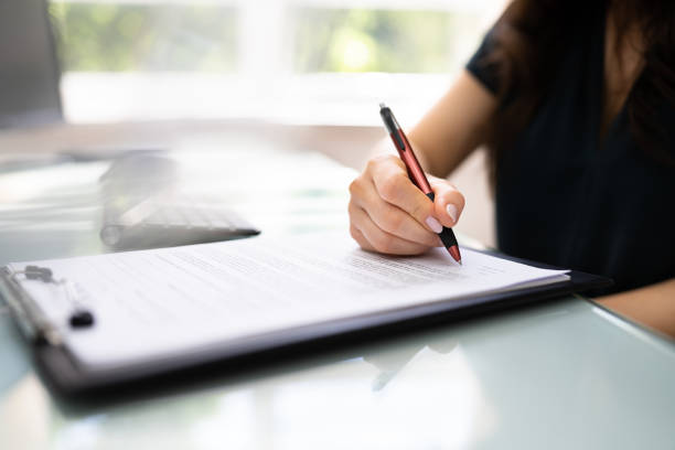 istock Lawyer Signing Business Contract Paper Document 1366274501