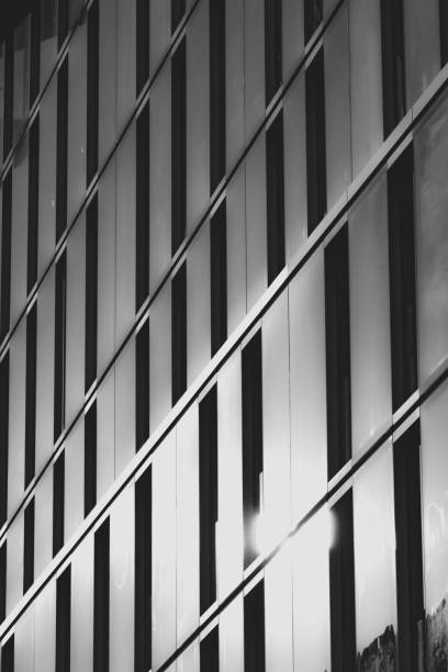 istock Monochrome abstract of sunlight reflecting in modern building 1366277046