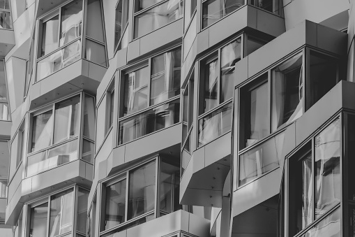 Facade and windows of apartment building. Low angle view