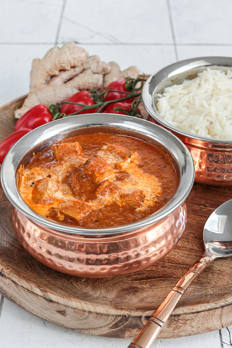 Butter Paneer Masala in copper bowl with rice