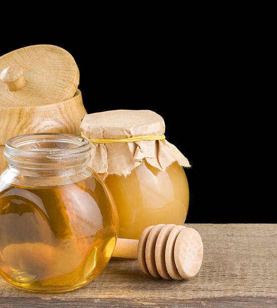 istock jar full of honey and stick 136627871