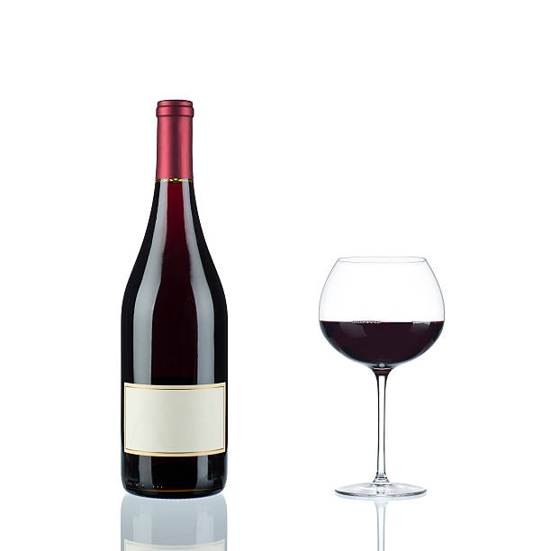 Red Wine in a Burgundy Bottle and Glass stock photo