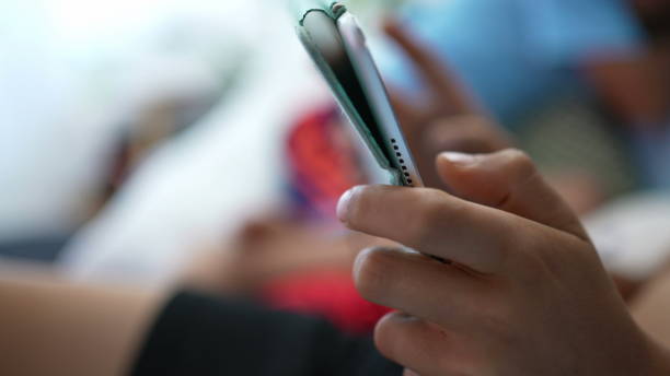 istock Little boy playing vide-game on portable console. Child plays game 1366280514