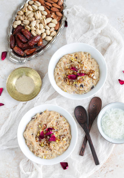 Traditional Sheer Khurma dish for Ramadan Iftar with rose water, nuts and dates