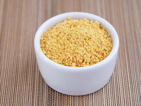 Soy lecithin in a bowl. Close up.