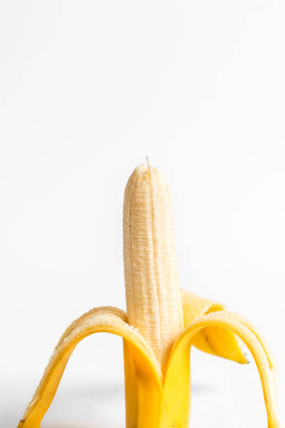 Banana peeled on white background