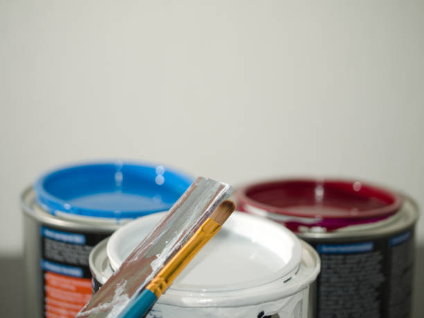 istock Paint cans wooden stick and brush 1366290530