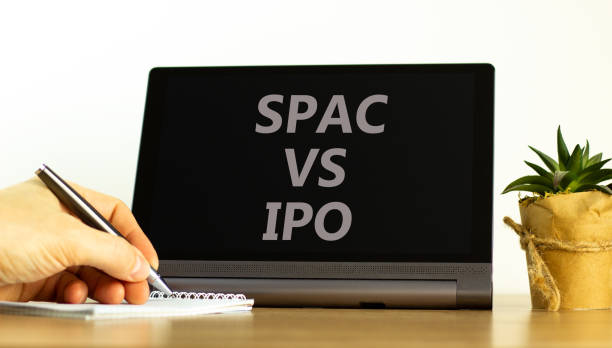 istock SPAC vs IPO symbol. Tablet with words 'SPAC, special purpose acquisition company vs IPO, initial public offering' on white background, copy space. Business and SPAC vs IPO concept. 1366292708