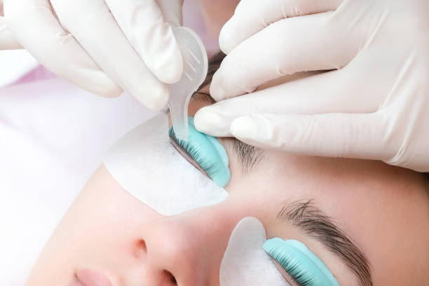istock Young woman doing eyelash lamination procedure 1366293526