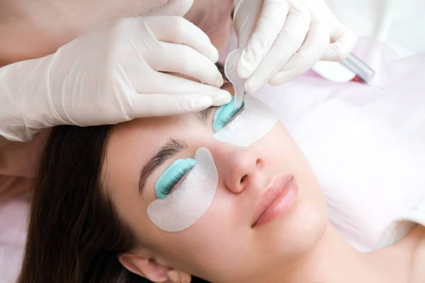 istock Young woman doing eyelash lamination procedure 1366293584
