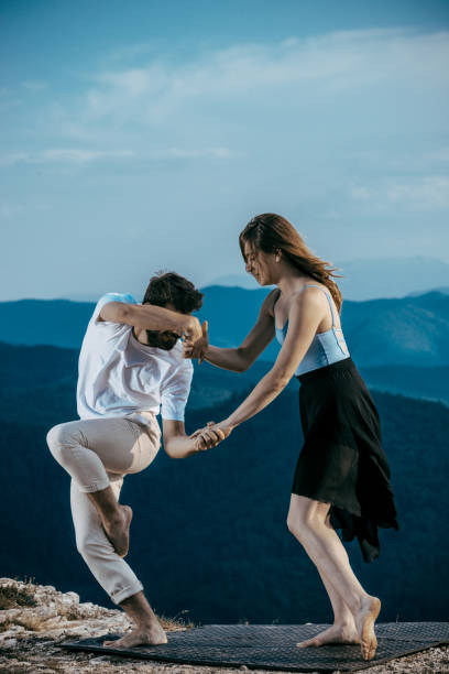Muscular man practicing with an attractive colleague Sensual couple performing an artistical and emotional contemporary dance contemporary dance stock pictures, royalty-free photos & images