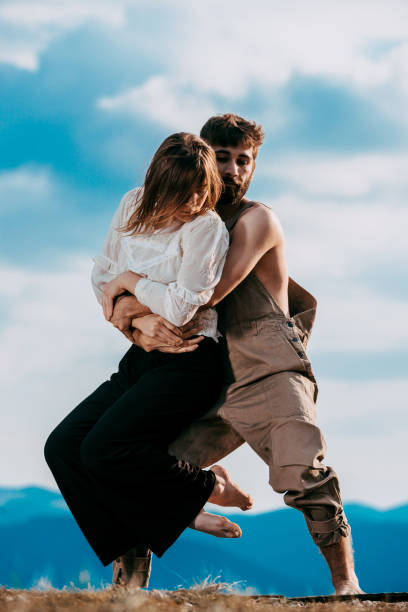 istock Beauty couple dancing social dance over sky with clouds 1366296677