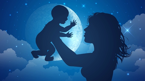 Silhouette of a mother holding a baby against the background of the moon and starry sky