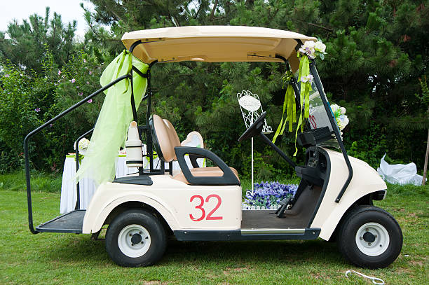 Decorated golf cart for an outdoor wedding stock photo