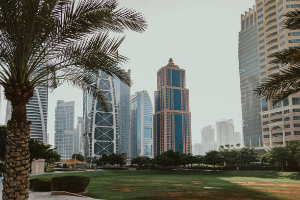 istock Park area with futuristic skyscrapers 1366304922