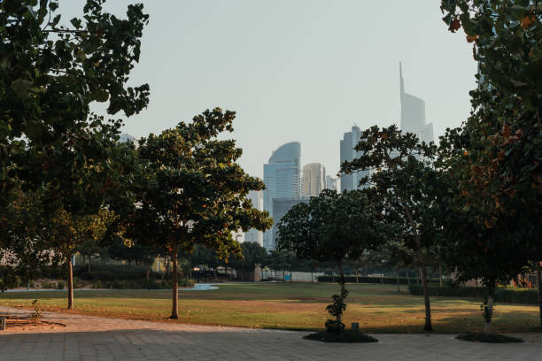 istock Park area with futuristic skyscrapers 1366305208