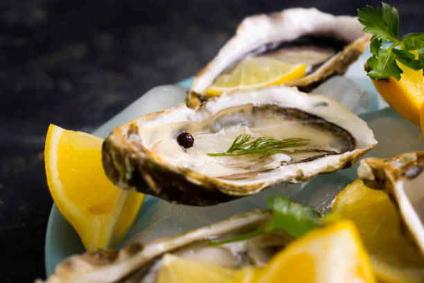 istock Fresh oysters oyster pieces lemon ice 1366306684