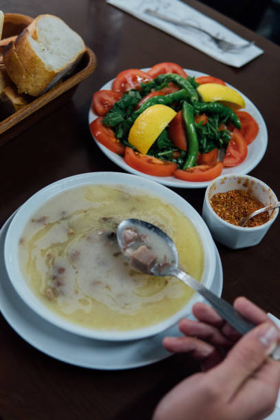 Traditional Turkish meat soup served with hot red pepper