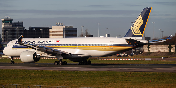 Manchester Airport, United Kingdom - 20 January, 2022: Singapore Airlines Airbus A350 (9V-SMU) accelerating on runway 23R for Takeoff.