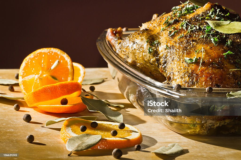 Turkey roasted and herbs serve with orange fruit Chicken roasted with herbs serve with orange fruit. Roast Chicken Stock Photo