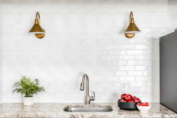 istock Bright White Kitchen with Subway Tile and Gold Fixtures 1366314327
