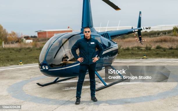 Businessman Using Helicopter Stock Photo - Download Image Now - Helicopter Pilot, Uniform, Helicopter