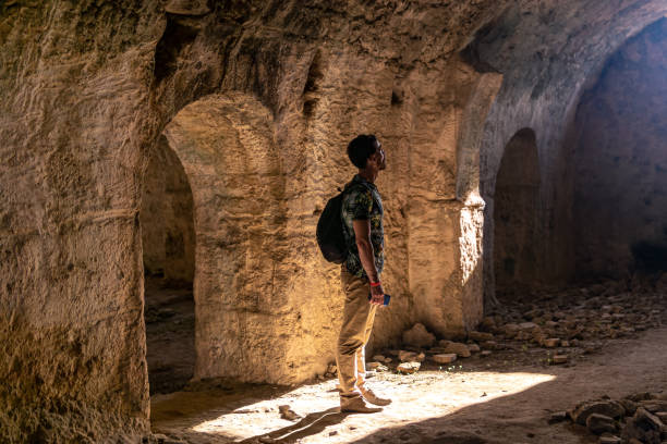 istock tourist visiting the dungeons of some ancient ruins 1366324190